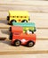 Closeup vertical shot of a disassembled wooden train toy on a table