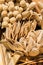 Closeup vertical shot of wooden sets of knives, spoons, forks and honey spoons