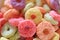 Closeup of vibrant fruity color sugary ring shaped cereal