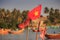 Closeup Vietnamese Flag on Fishing Boat in Sea against Palms