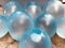 closeup view of blue balloons filled with water, wet