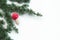 Closeup view cedar branches and Christmas decoration mushroom on a white background. Christmas background. Selective focus. The pl