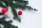 Closeup view cedar branches and Christmas decoration mushroom on a white background. Christmas background. Selective focus. The pl