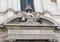 Closeup view of the Church of Saint Irene, featuring a she wolf and the ilex tree, the symbols of Le