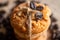 Closeup view of coffeebeans kept on the top of knotted cookies