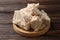 Closeup view of compressed yeast on wooden table