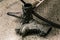 closeup view of dark grey pair of stylish boots, man`s wear on dark concrete floor