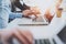 Closeup view of female hands working on mobile computer.Blurred background.