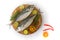 Closeup view of fresh Finletted Mackerel Fish or Torpedo Fish decorated with spices and herbs .