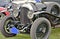 Closeup view of front tires, fenders, and headlights of a classic Bentley