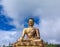 Closeup view of giant Buddha Dordenma statue with the blue sky and clouds background, Thimphu, Bhutan