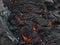 Closeup view of glowing lava rocks cooling down after volcanic eruption near Fagradalsfjall mountain, GrindavÃ­k, Iceland.