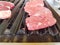 Closeup view of a grill for meat or steak where people cook their own food in a restaurant