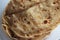 Closeup view of hand made plain bread in oil called paratha roti