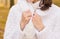 Closeup view of hands of elegant white bride