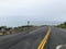 A closeup view of the highway 1 road along the rugged shoreline of the northern california with rugged endless views of the ocean