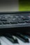 Closeup view of keyboard synthesizer keys and buttons.