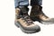 Closeup view of man leg in trekking boots
