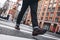 Closeup view of man legs wearing shoes crosswalk road