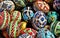 Closeup view of many Romanian traditionally decorated easter eggs on white surface