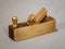 closeup view of a mini brass hand plane for violin makers