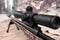 Closeup view of modern powerful sniper rifle with telescopic sight outdoors