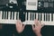 Closeup view of music instrument, man hand play synthesiser electronic keyboard