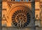 Closeup view of the Notre Dame de Paris Cathedral facade with the oldest rose window installed in 1225 which forms a halo above