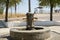 Closeup view of old metal rusty faucets in the water fountain at the park