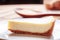 Closeup view of piece of delicious freshly baked cheesecake