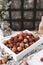 closeup view of pile of lychees in wooden box