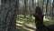 Closeup view of pine forest with green grass at sunny summer day