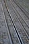 Closeup view of tram tracks surrounded by cobblestones in Lisbon