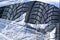 Closeup view of a tread fragment of a new film-wrapped winter tire