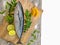 Closeup view of Tuna fish decorated with fruits and herbs on a wooden background,Selective focus