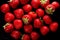 A closeup view of a vibrant, ripe strawberry, showcasing its delicious red hue