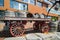 Closeup view of vintage classic horse drawn carriage loaded with wooden barrels