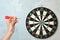 Closeup view of woman playing darts