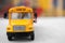 Closeup view of yellow toy school bus, space for text. Transport for students