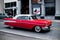 Closeup of a vintage classic red car on the streets of Boston in Massachusetts