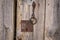 Closeup vintage door lock of external antique wooden door of Country house