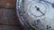 Closeup of vintage pocket clock time going fast