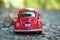 Closeup of vintage red miniature volkswagen bettle in outdoor