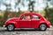 Closeup of vintage red miniature volkswagen bettle in outdoor