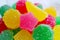 Closeup Vivid Pink Star Shaped Sugar Coated Jelly Candy on Candies Pile