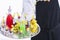 Closeup of a waiter pouring liquor into glass shots