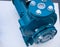 Closeup water pump motor on white desk. drainage or irrigation hardware equipment