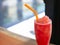 Closeup watermelon smoothie on wood table, selective focus