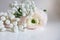 Closeup of wedding bouquet made of Persian buttercups, Ranunculus and white baby`s breath Gypsophila flowers lying on
