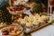 Closeup of a wedding candybar with cakes and fruits